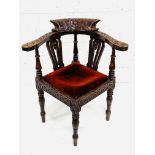 Carved oak corner armchair
