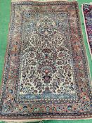 Beige floral decorated hand knotted rug together with a blue and red ground brown rug