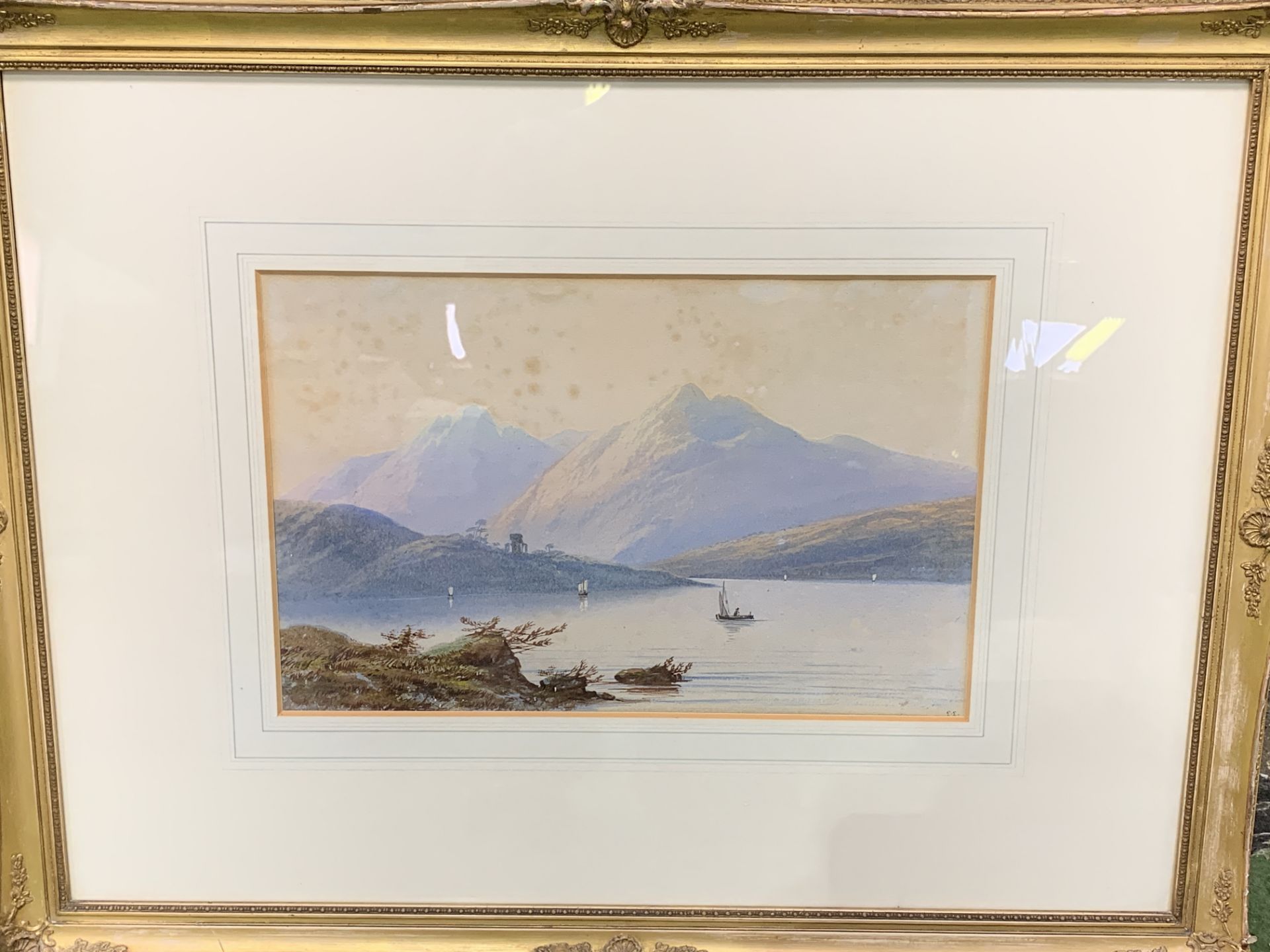 Gilt framed and glazed watercolour of boats on a lake with mountains, (foxed), signed monogram E E - Bild 3 aus 3