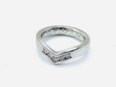 18ct white gold ring in wishbone design, channel set with five brilliant cut diamonds