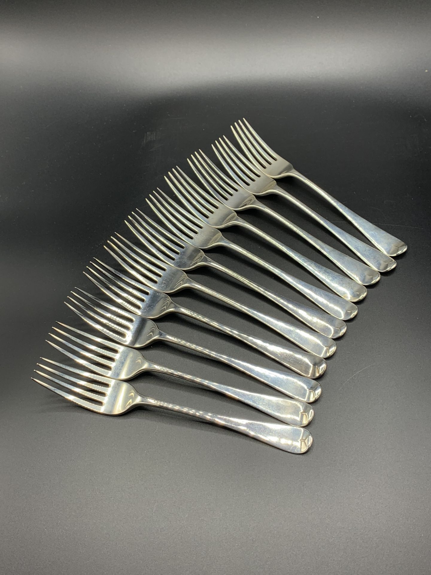 Eleven late Georgian silver dessert forks, London 1829 by William Cripps