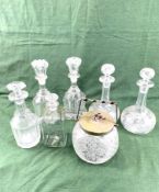 A pair of Victorian decanters, a pair of Edwardian decanters, and a cut glass biscuit barrel