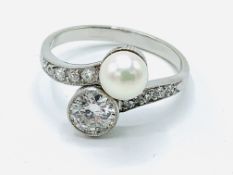 Platinum, diamond and pearl twist ring, with graduated diamonds to shoulders.