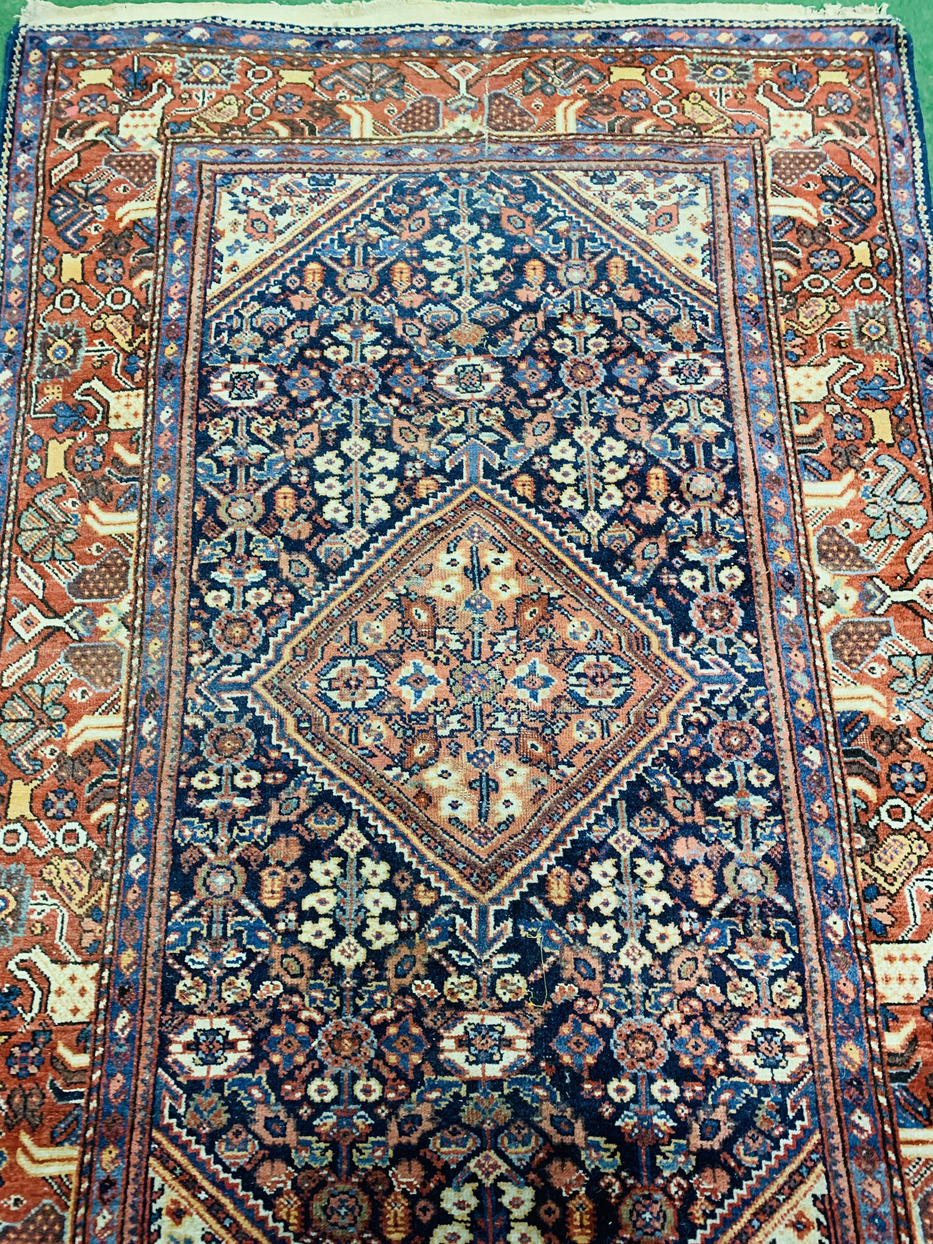 Red and blue ground hand knotted rug