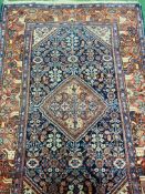 Red and blue ground hand knotted rug