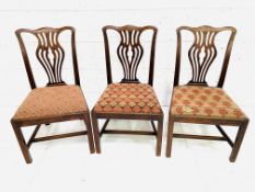 A group of three 18th century mahogany dining chairs