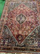 Dark red ground Qashqai Persian rug