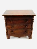 Miniature wooden chest of drawers