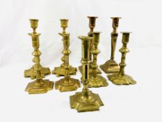 Two pairs of Georgian brass candlesticks, along with two other brass pairs and a single stick