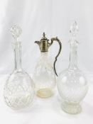 Two faceted glass decanters and a claret jug
