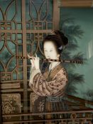 Framed Oriental oil on board of a lady playing a flute, unsigned