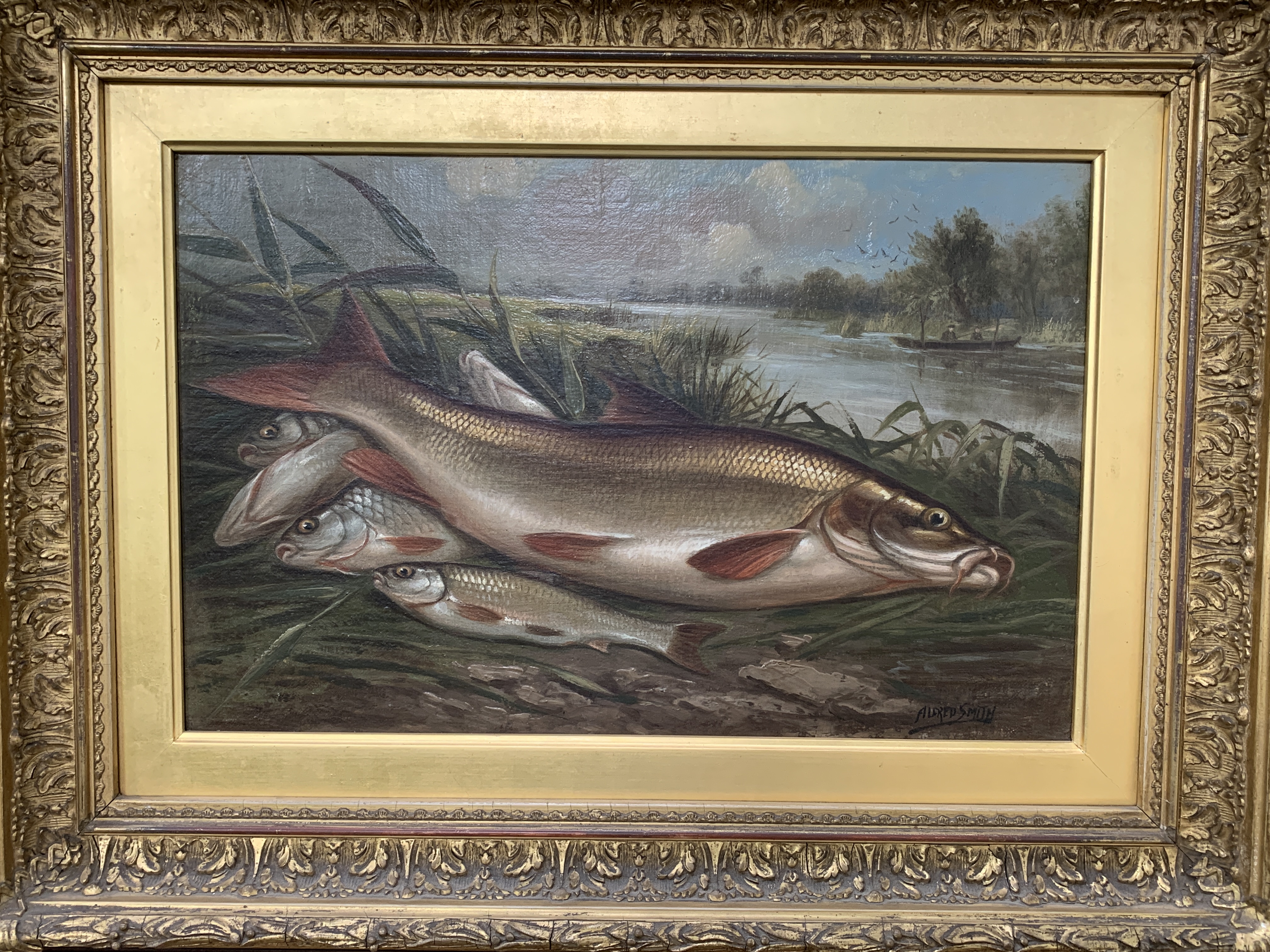 Gilt framed oil on canvas signed Alfred Smith with label on reverse "Fish on a Riverbank"