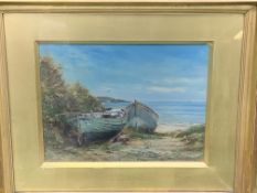 Gilt framed and glazed oil on board of a beach scene with boats, signed J. Laurence Hart 1902