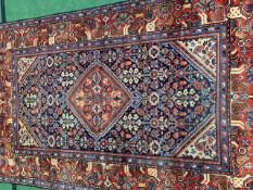 Blue and red ground hand knotted rug