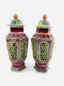 Pair of Oriental lidded vases with lattice work exterior