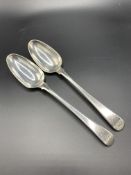 A pair of mid-18th century fiddle pattern silver table spoons