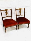 A pair of Victorian mahogany nursing chairs