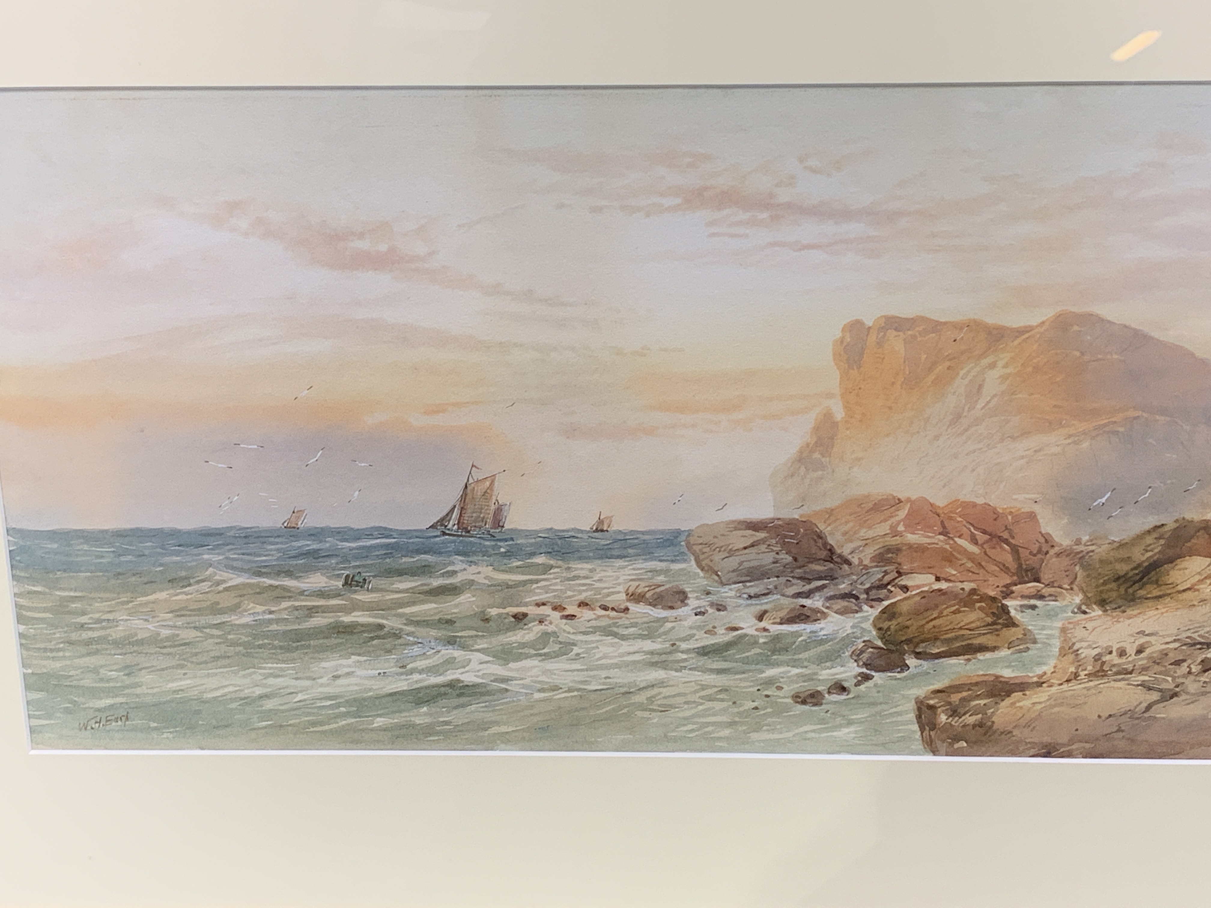 Framed and glazed watercolour of cliffs and sailing ships, signed W H Earp. - Image 2 of 3