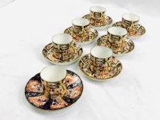 Six Royal Crown Derby coffee cans and saucers, and another cup and saucer