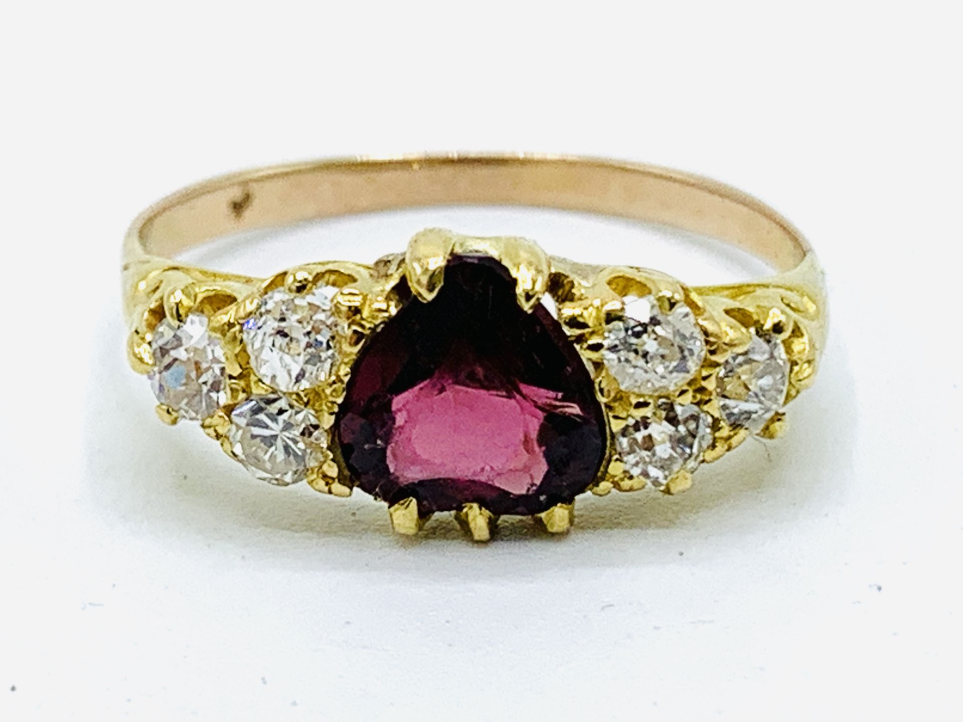 Yellow gold, garnet and diamond ring