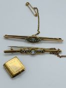 9ct gold charm and two 9ct gold bar brooches