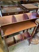 Edwardian mahogany stand of two book troughs, on castors