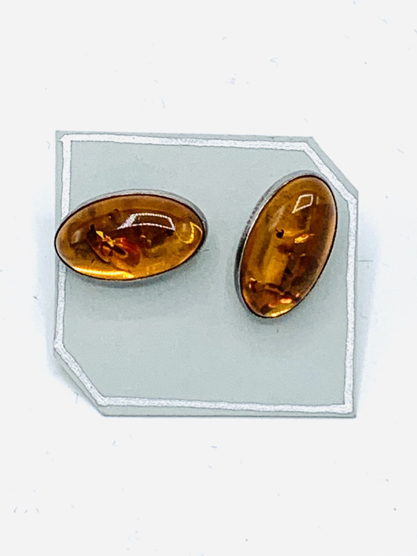 Pair of amber earrings set in 925 silver