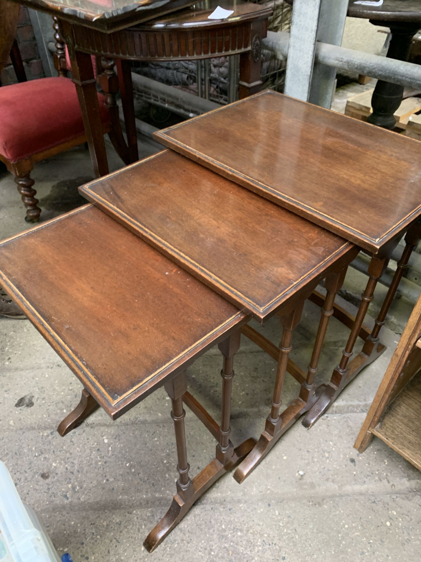 Nest of three mahogany tables