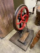 Metal treadle operated flywheel