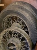 Two vintage wire wheels and tyres, together with a wire wheel