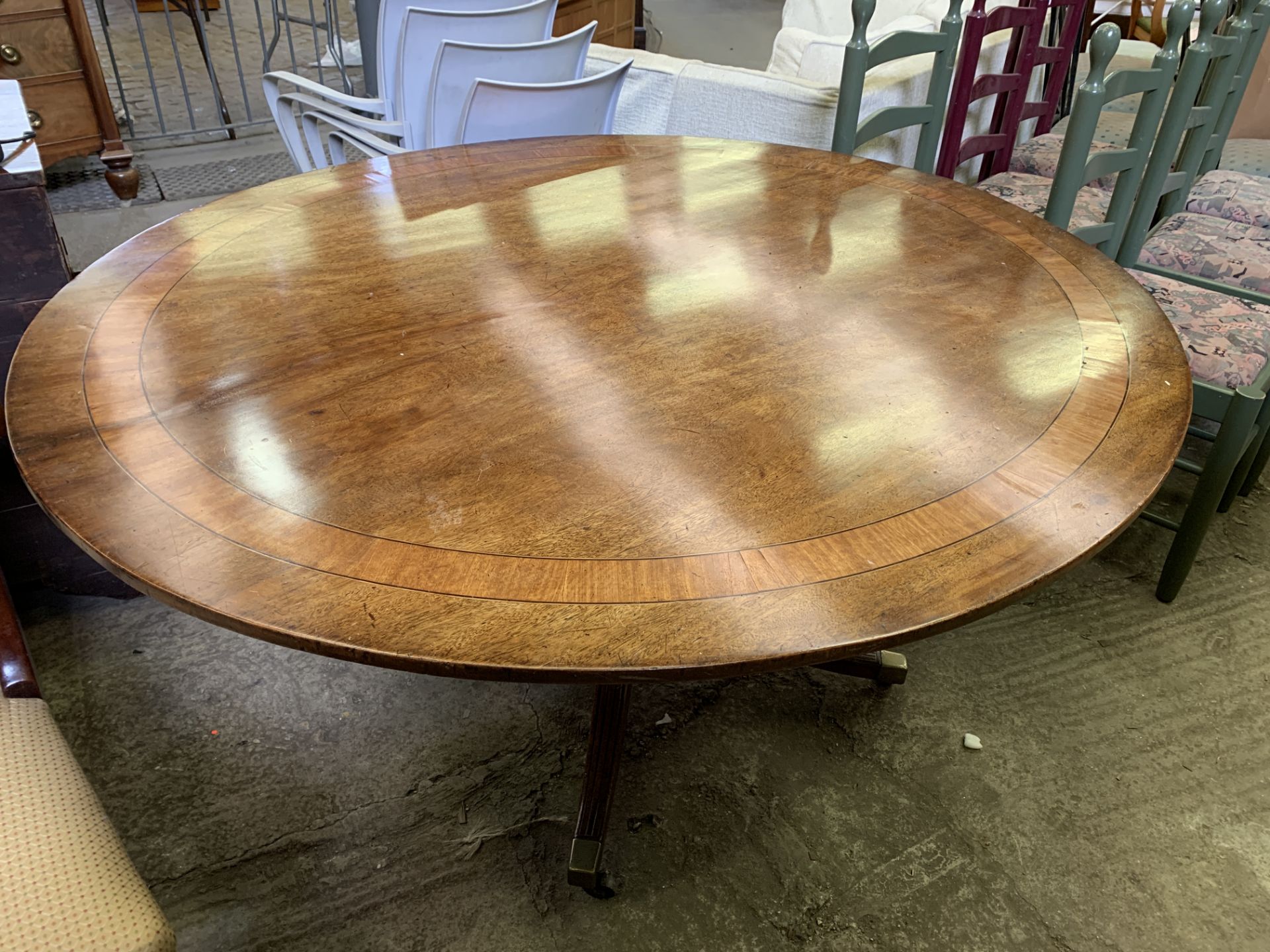 Inlaid mahogany oval tilt top dining table