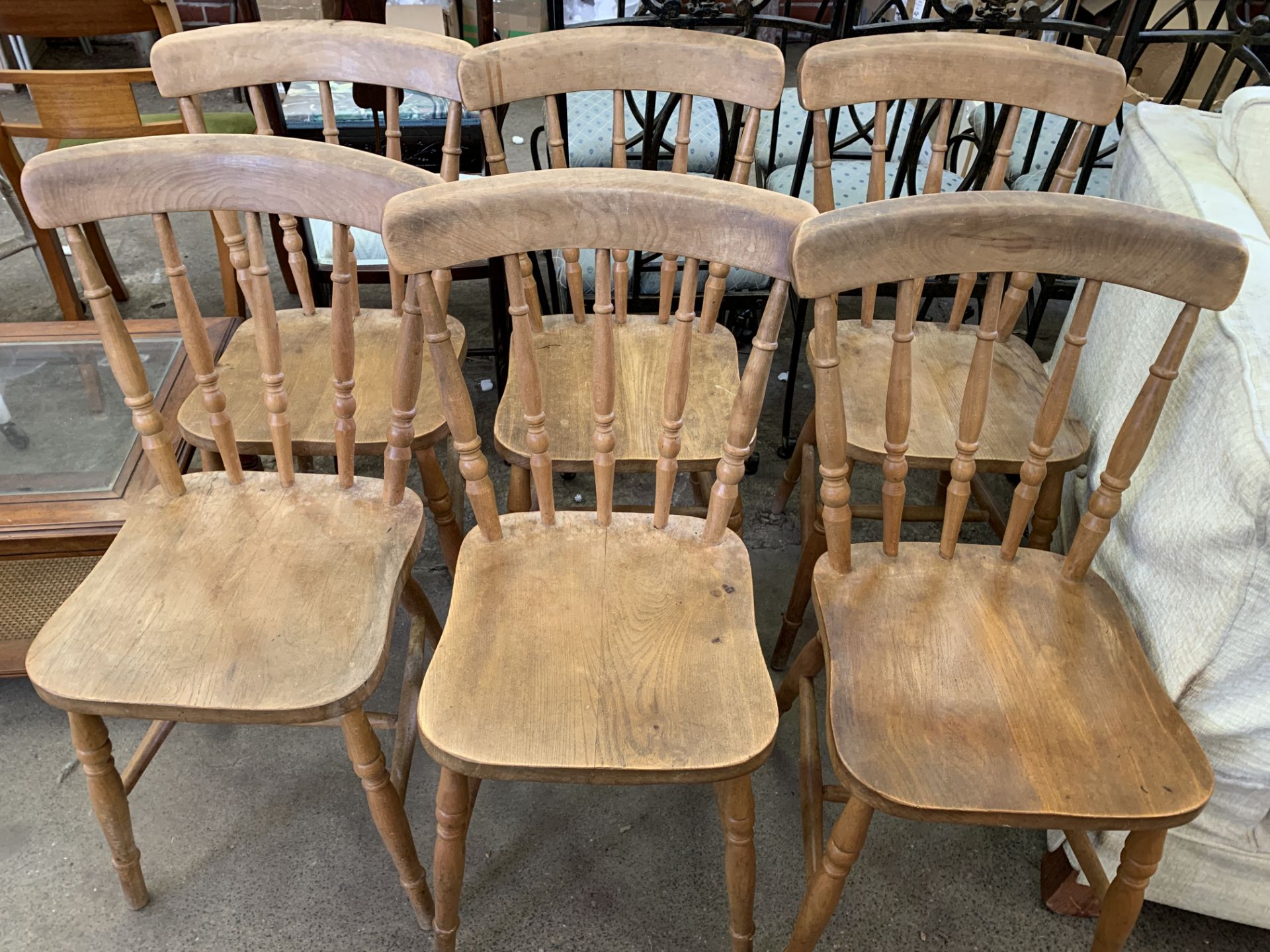 Six pine rail back chairs