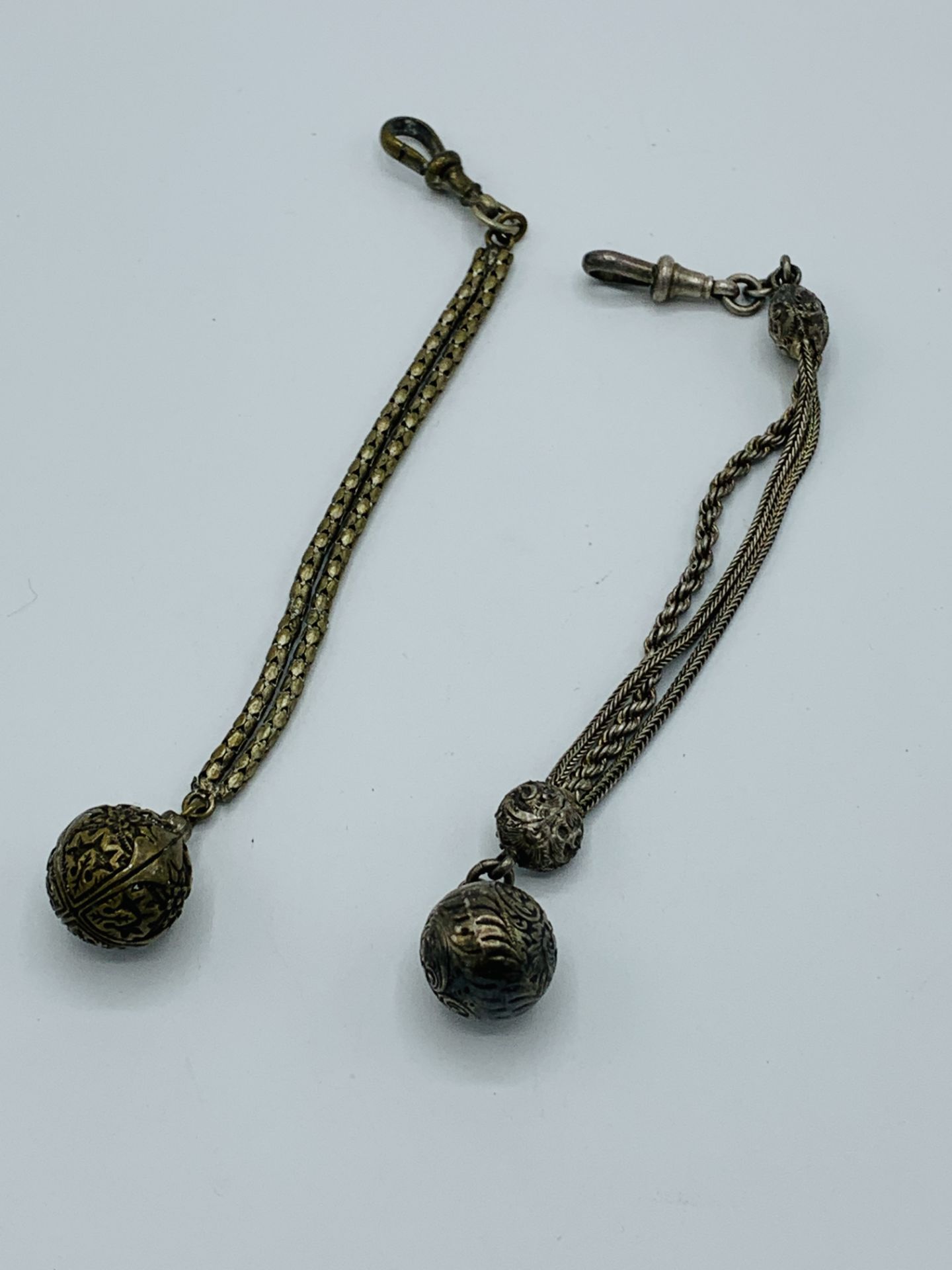 Two decorative ball fobs