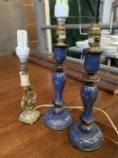 A pair of table lamps and one other