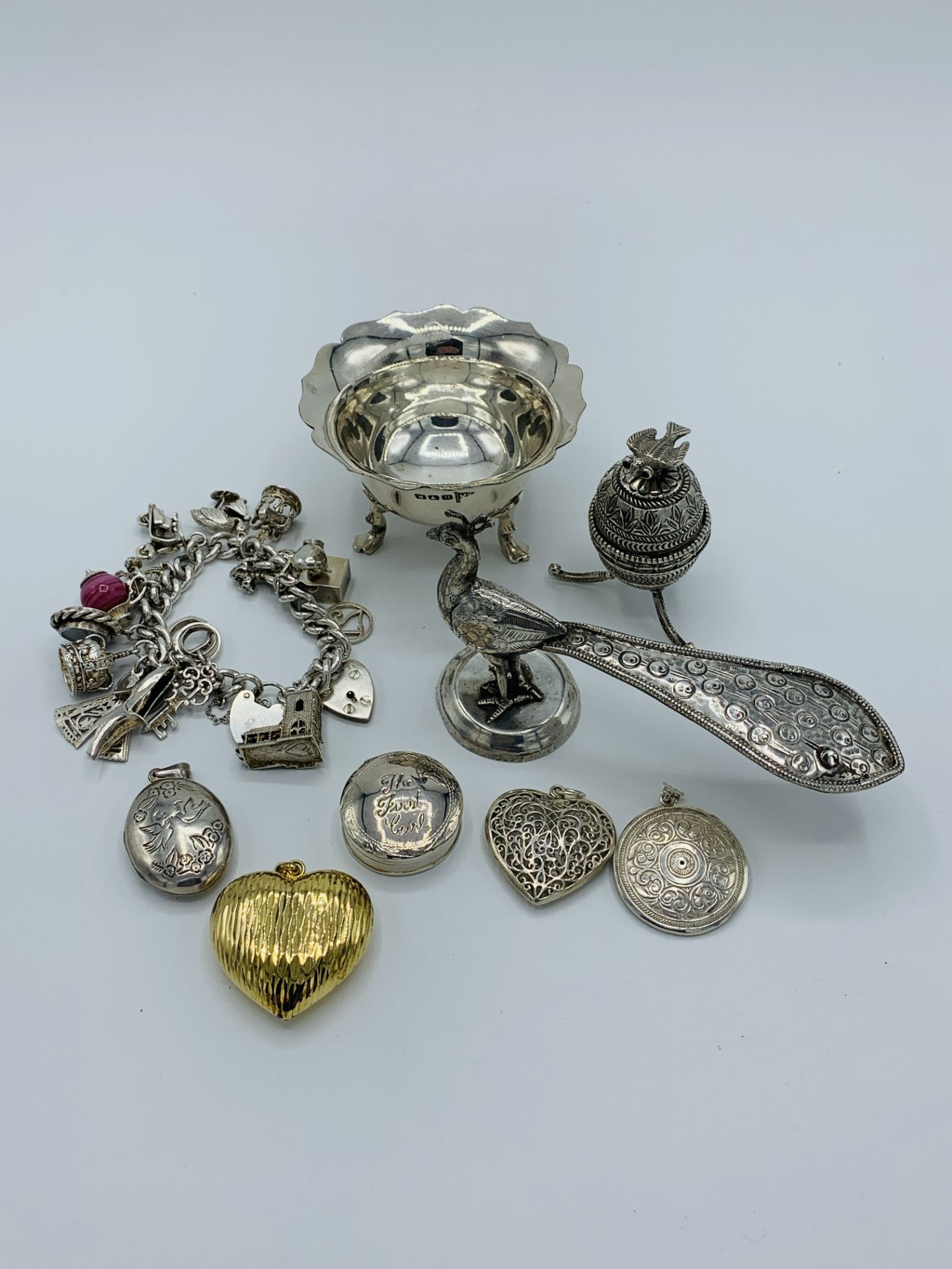 A collection of various silver and other items