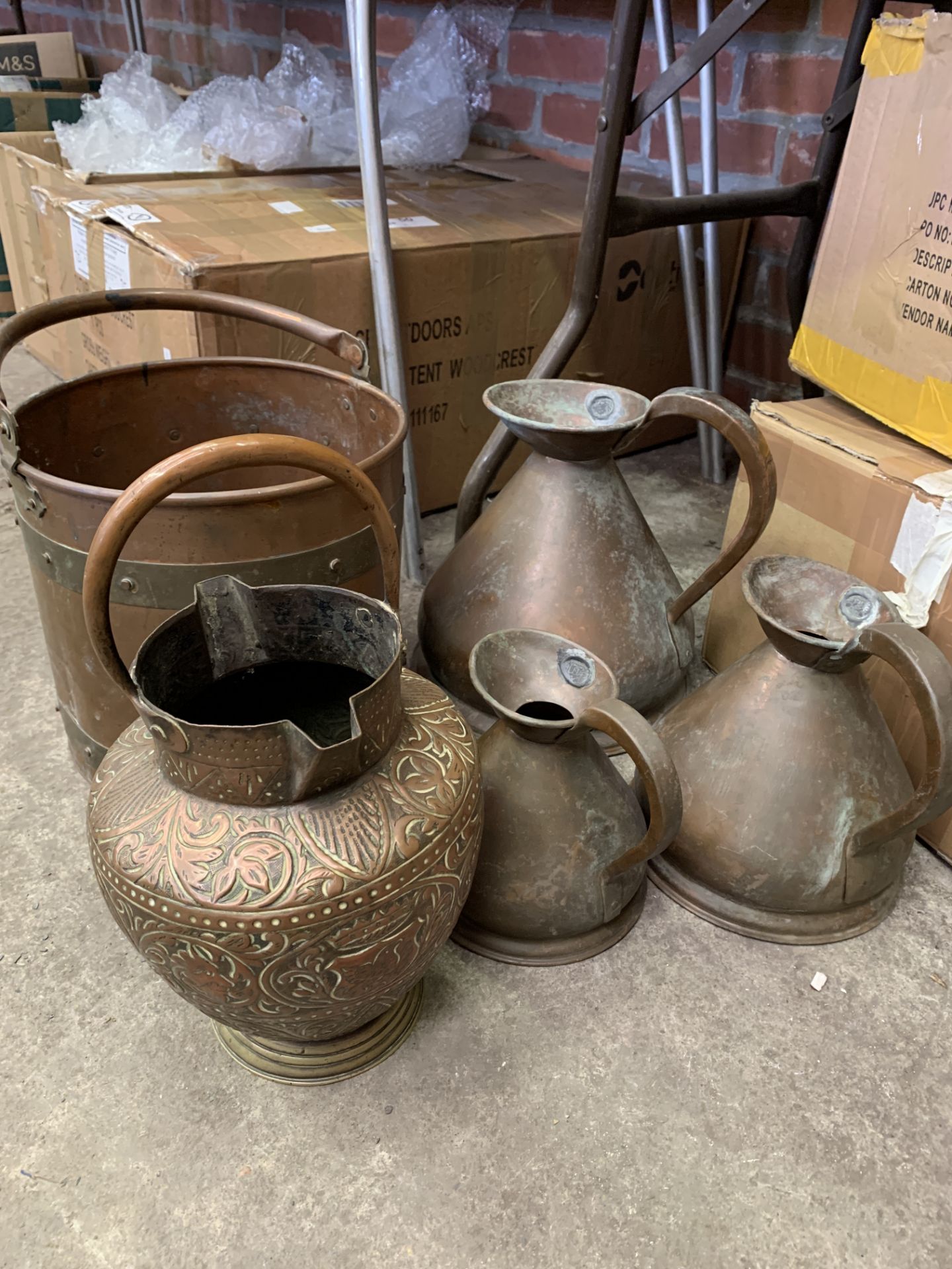 Three graduated copper measures, a brass bound pail and a Middle Eastern flagon