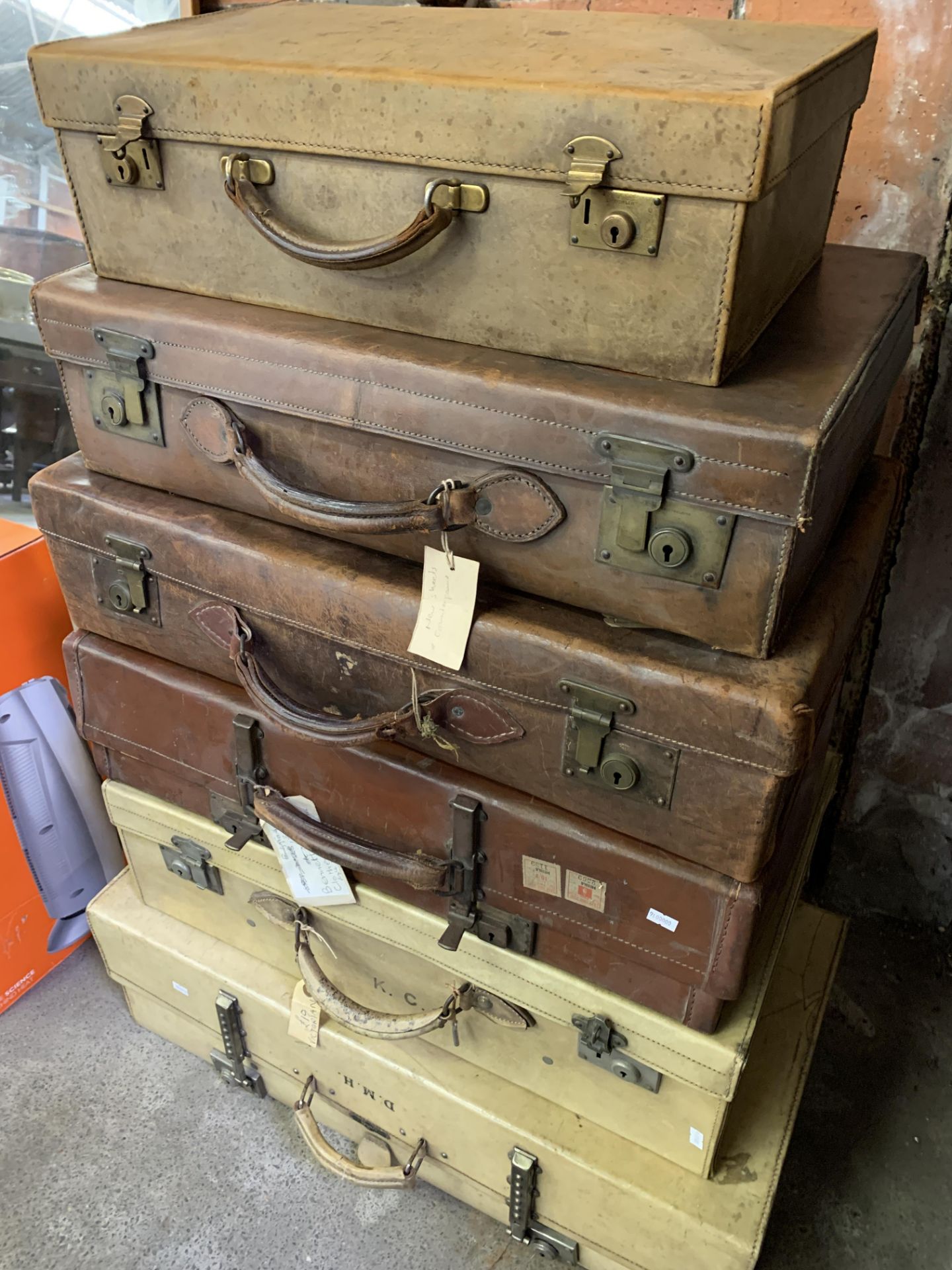 Two velum suitcases and four leather suitcases
