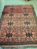 Red ground hand knotted rug