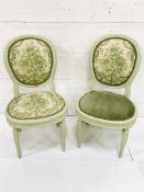 Two painted wood dining chairs