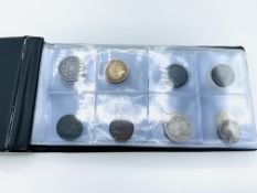 Coin book containing 64 tokens and coins