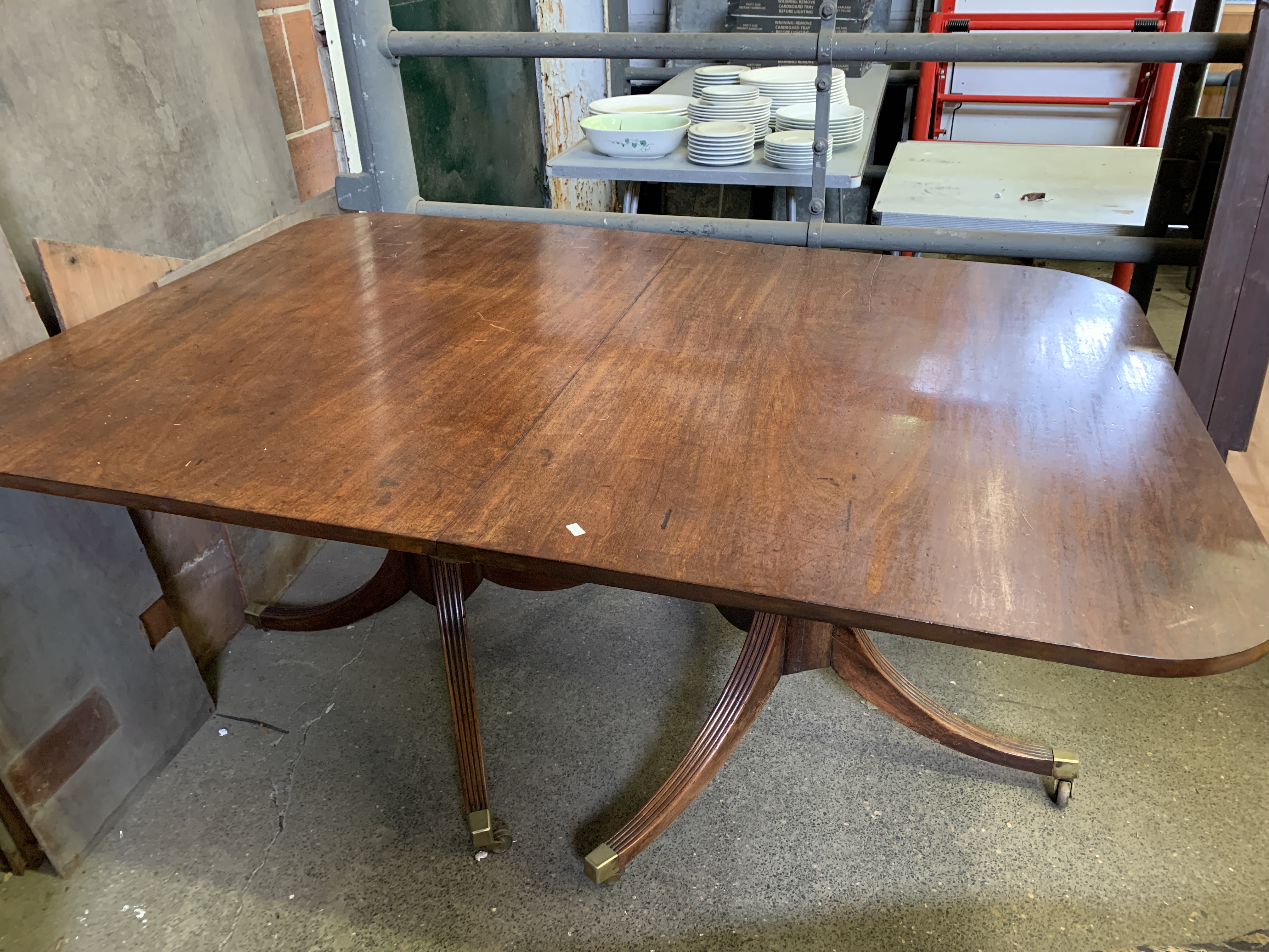Mahogany extendable pedestal dining table