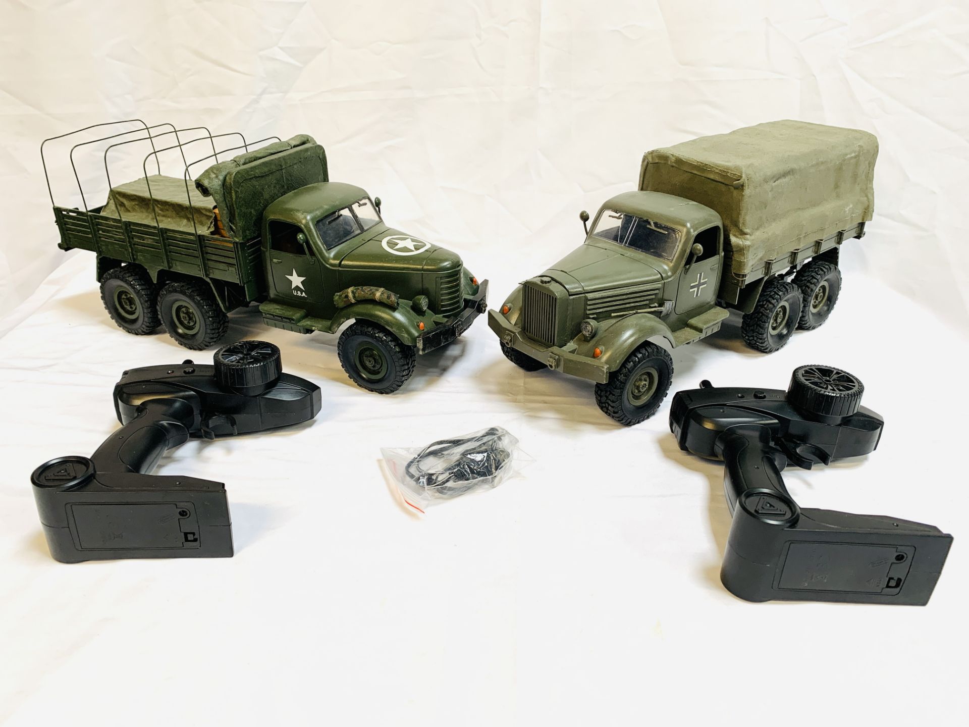 Two JJRC Q series 2.4G remote control off road military trucks