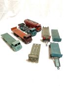 Four Dinky toys model lorries and flatbed trailers