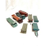 Four Dinky toys model lorries and flatbed trailers