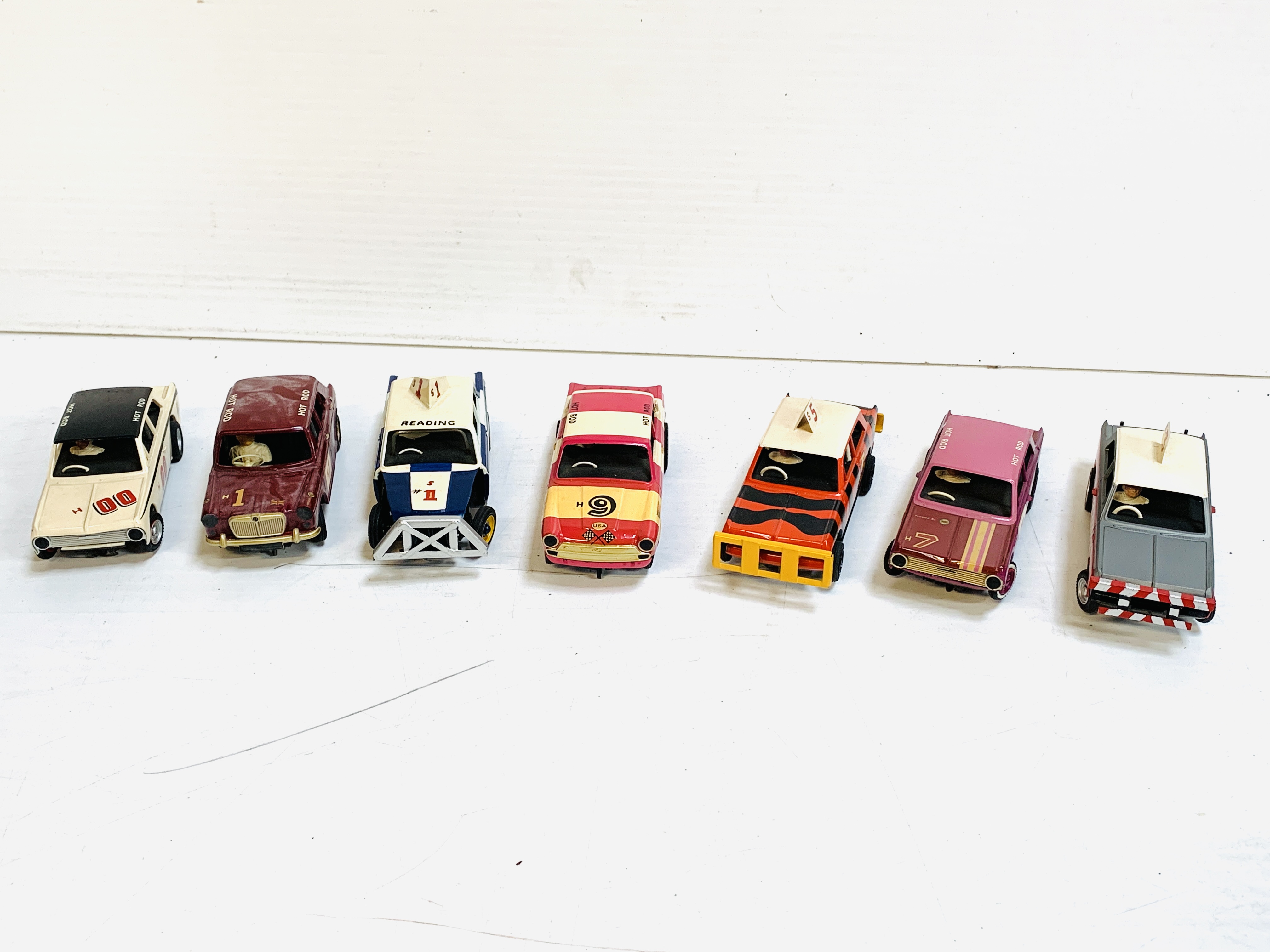 Seven Airfix slot cars.