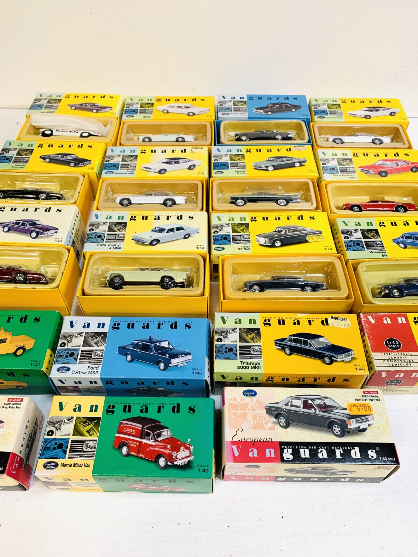 Nineteen boxed Vanguards diecast model cars and vans.