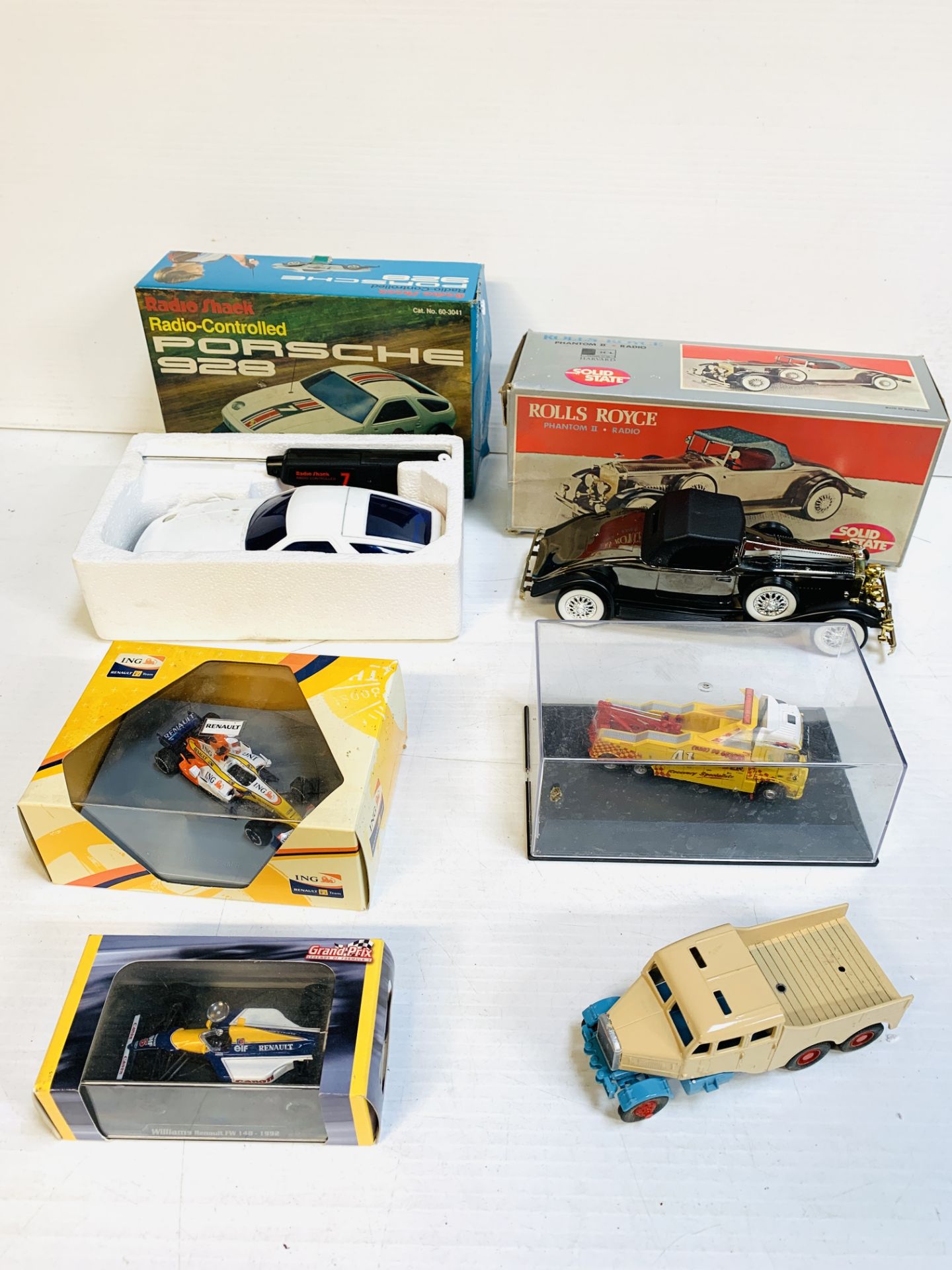 A Rolls Royce Phantom II transistor radio; a Radio-controlled model Porsche 928 with others