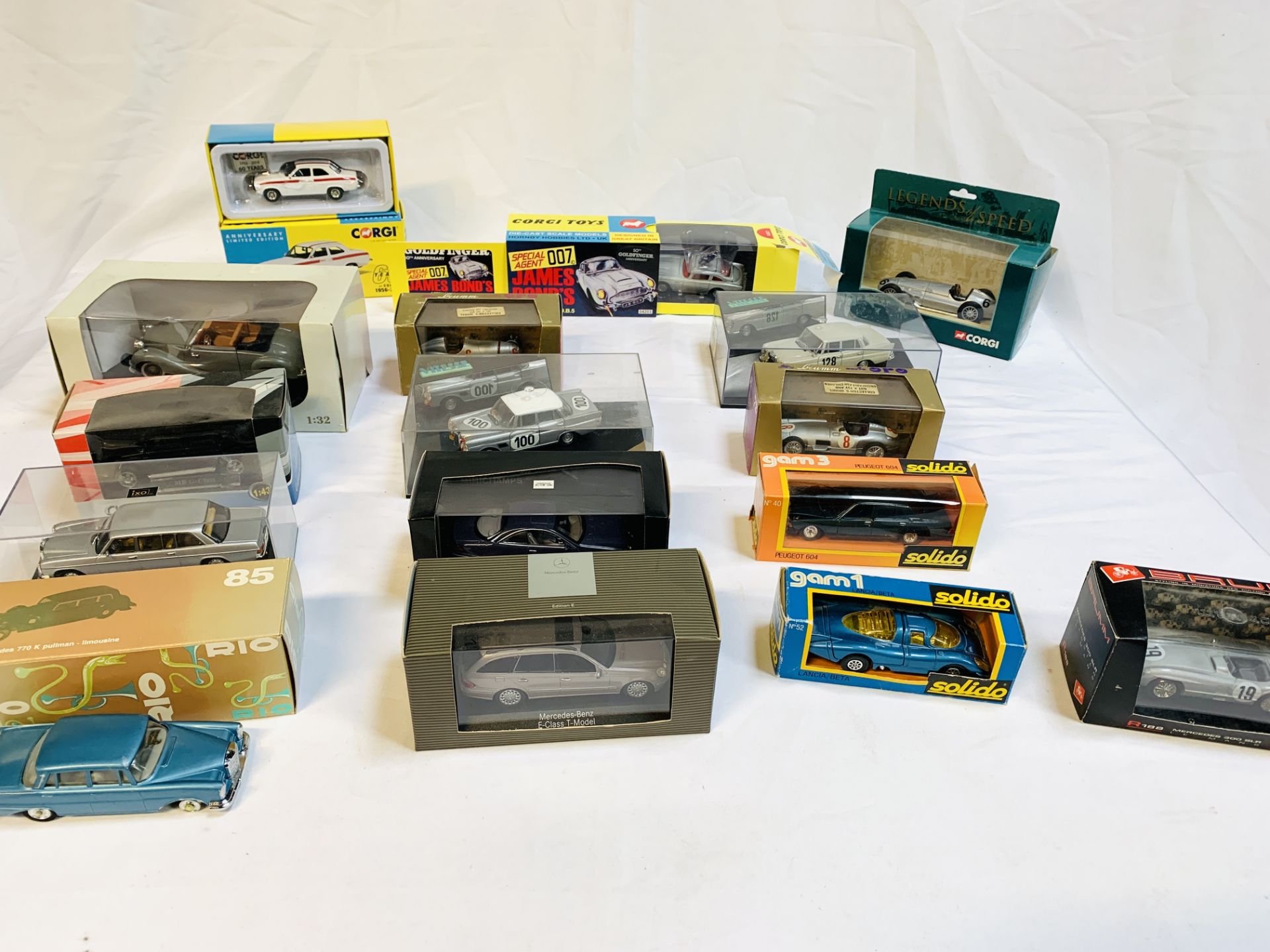 Sixteen die-cast model cars