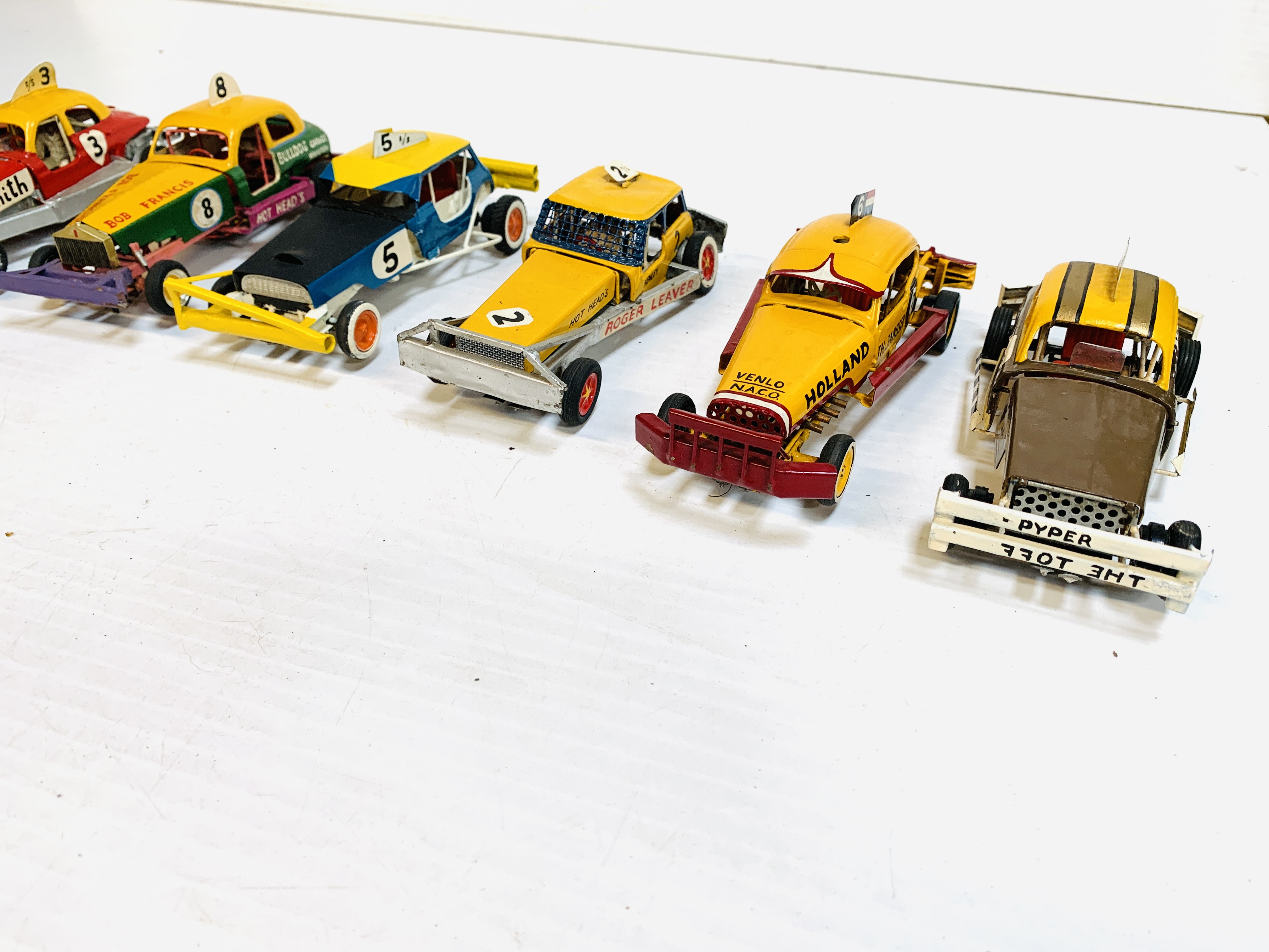 Eight drag racing slot cars.