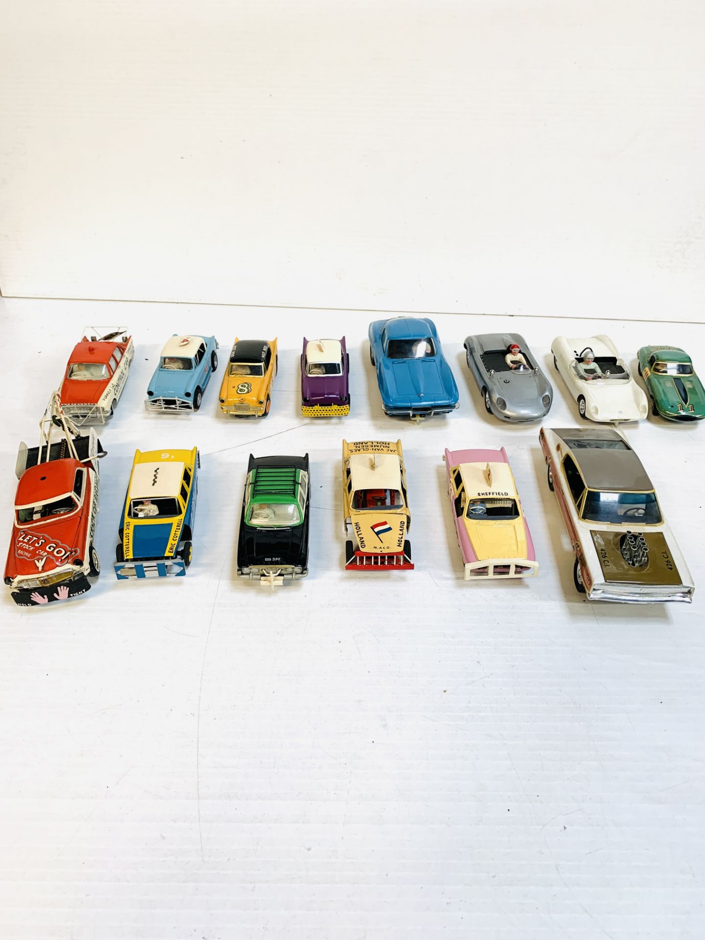 Fourteen various slot cars